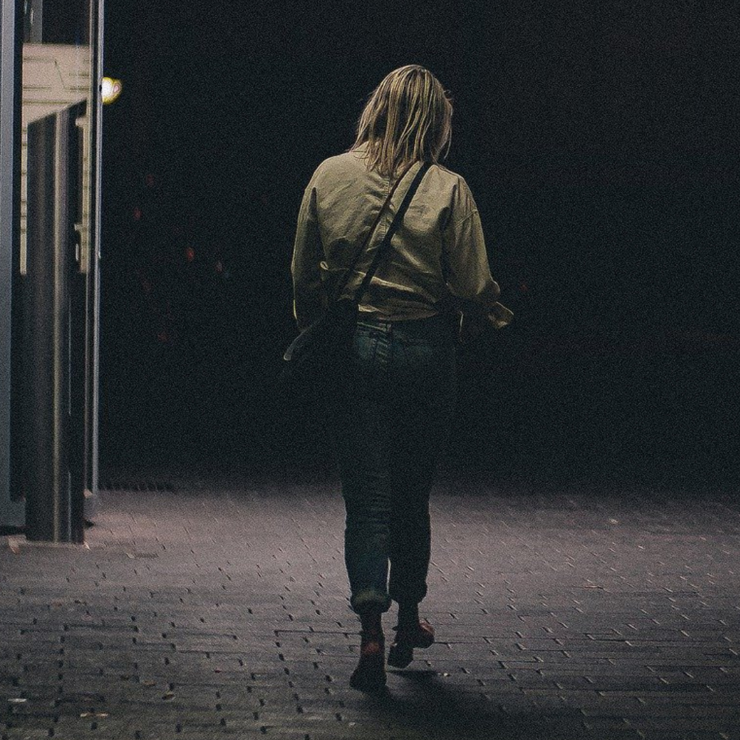 A Woman Walking Alone At Night