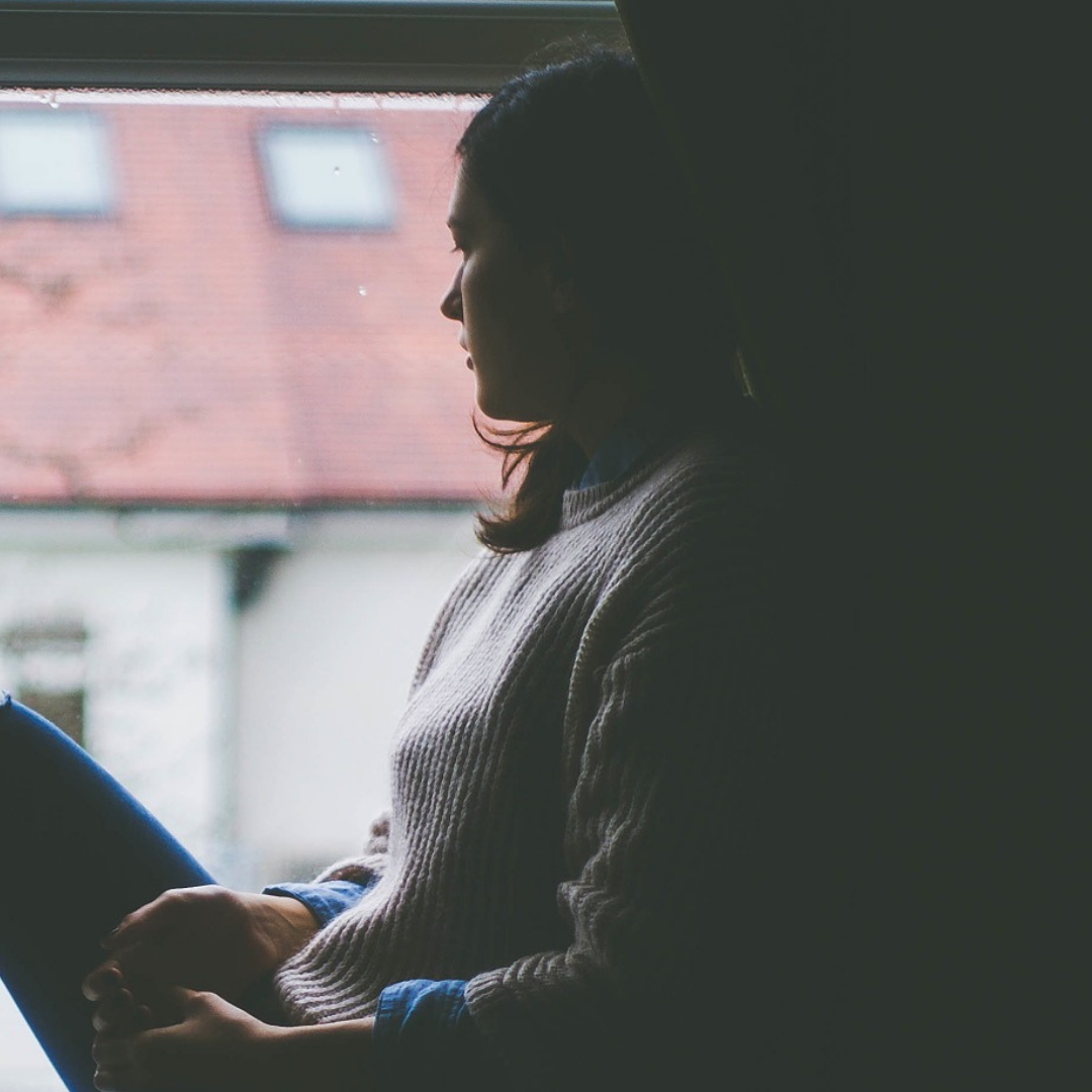 A woman looking out of the window