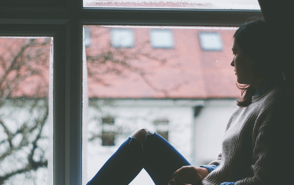 A woman looking out of a window