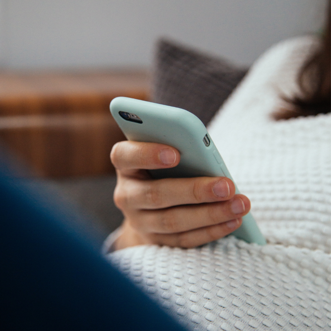 A woman looking at her phone