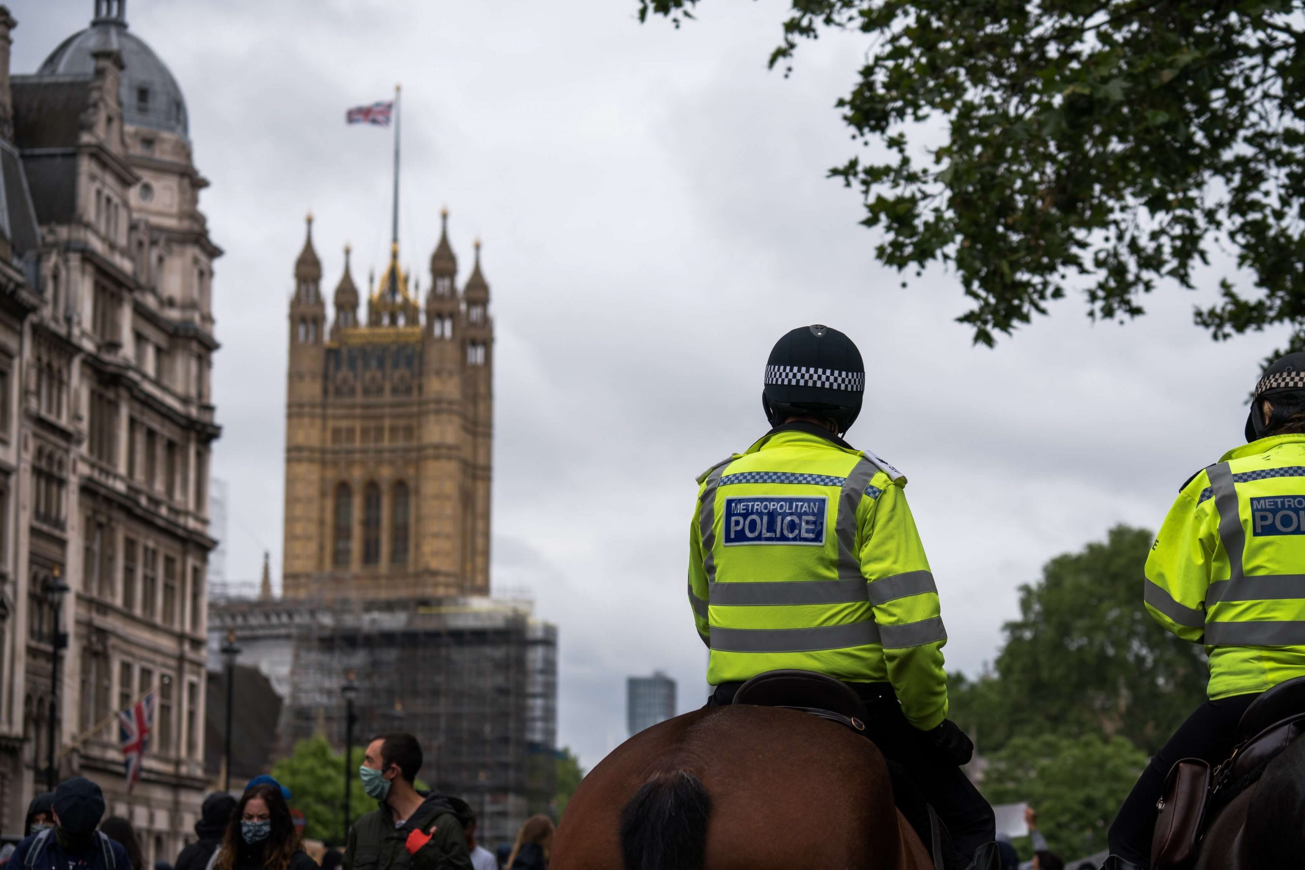 Police Officers Looking At Big Ben