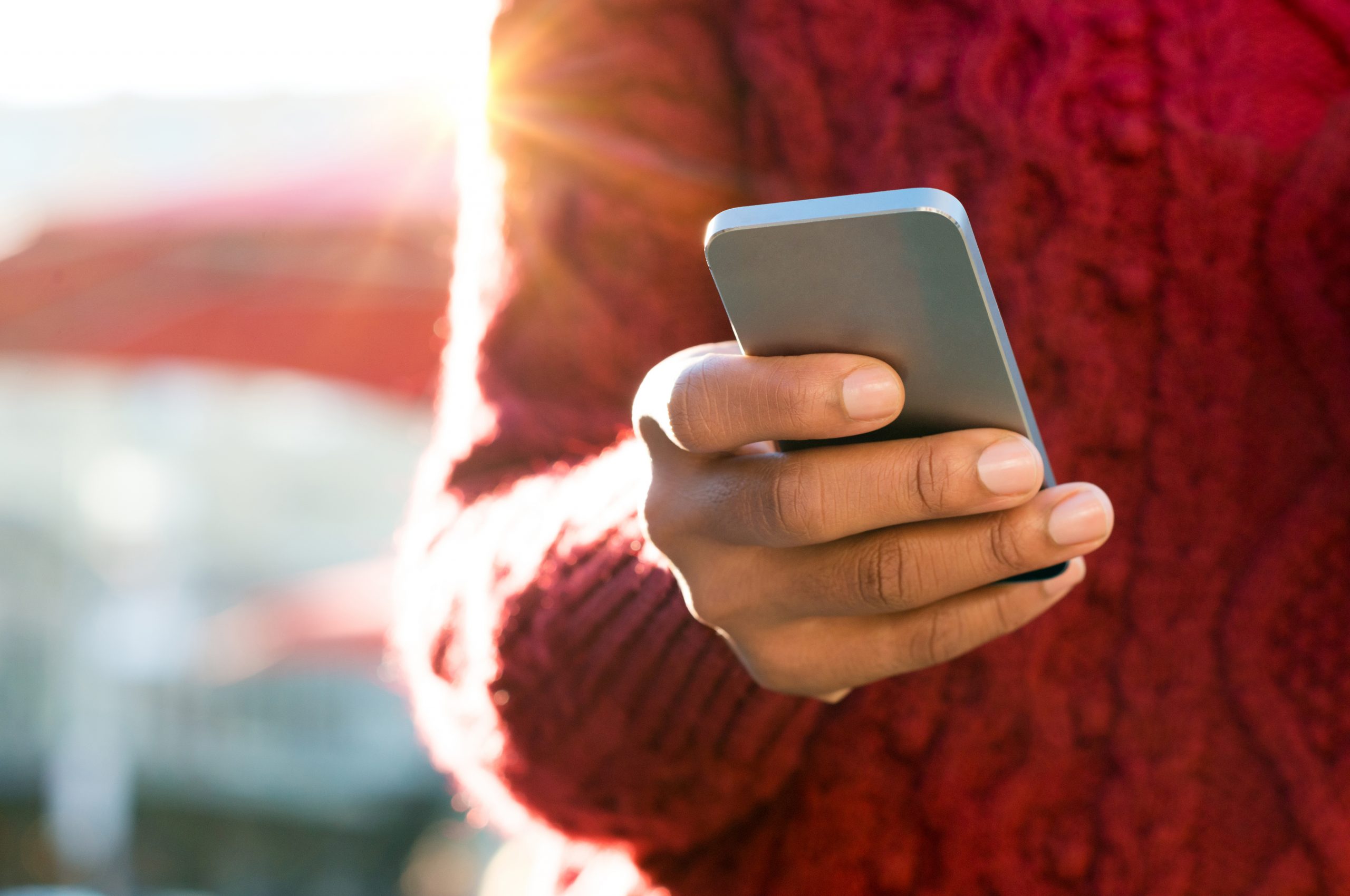 woman's hand holding a mobile phone