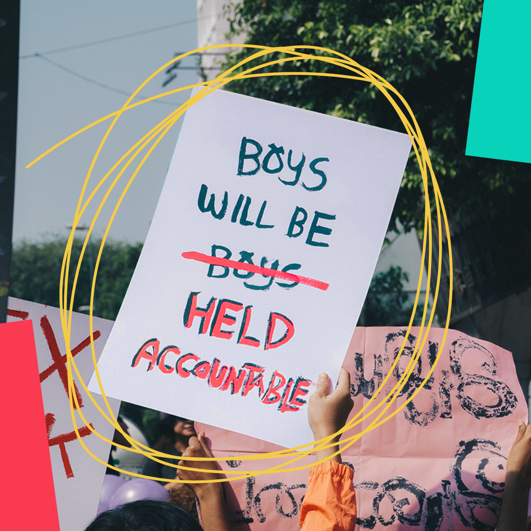 placard that reads 'boys will be held accountable'