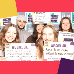 A group of young people holding signs calling on government, men and boys to make a change