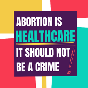 A placard that says: abortion is healthcare! It should not be a crime